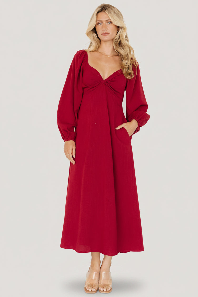 Three-quarter angle of scarlet Rosalie Back Tie Dress highlighting elastic shoulders, soft drape, and comfortable fit.