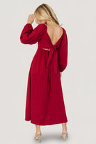 Back view of scarlet Rosalie Back Tie Dress featuring the open-back with adjustable tie detail and subtle waist shaping.