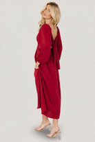 Detail image of sleeve and cuff on the Rosalie dress, showing elastic cuff and the garment's fluid movement.