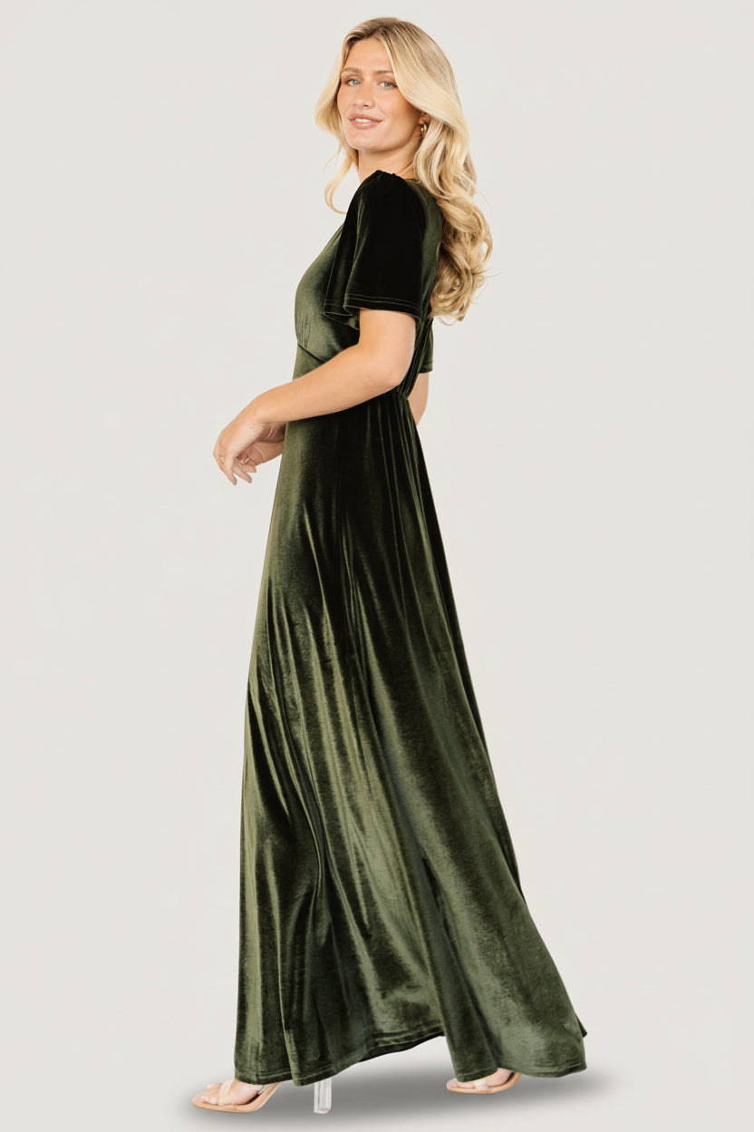 Close-up of stretch velvet fabric with visible texture and gathered bust detailing that shows subtle sheen and soft drape.
