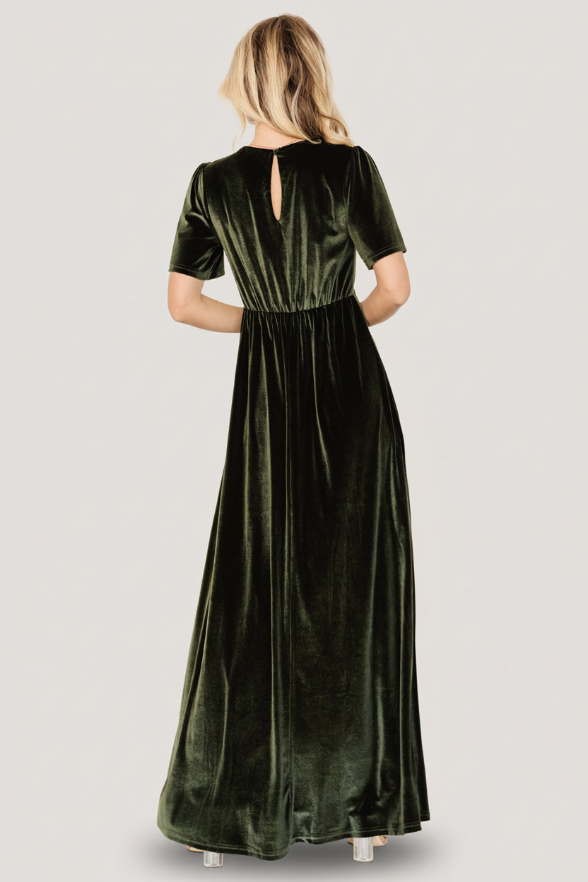 Detail shot of flutter sleeve and shoulder seam on the olive Vivian Velvet Maxi Dress, showing fabric movement and clean finish.