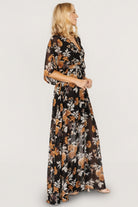 Side view of maxi skirt with left-side leg slit and lining visible to mid-thigh for modesty while maintaining flow.