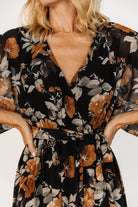 Detail shot of elastic waistband and detached self-tie sash showing styling options and gentle gathering at the waist.