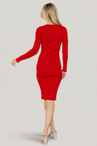 Back and side view of the red Mavis Ribbed Midi Dress on model, illustrating the fitted silhouette, long sleeves and where the midi hem falls.