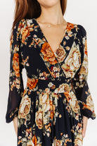 Styled look: Johanna Midnight Floral dress with simple heels, showing movement in the tiered skirt and delicate floral print.