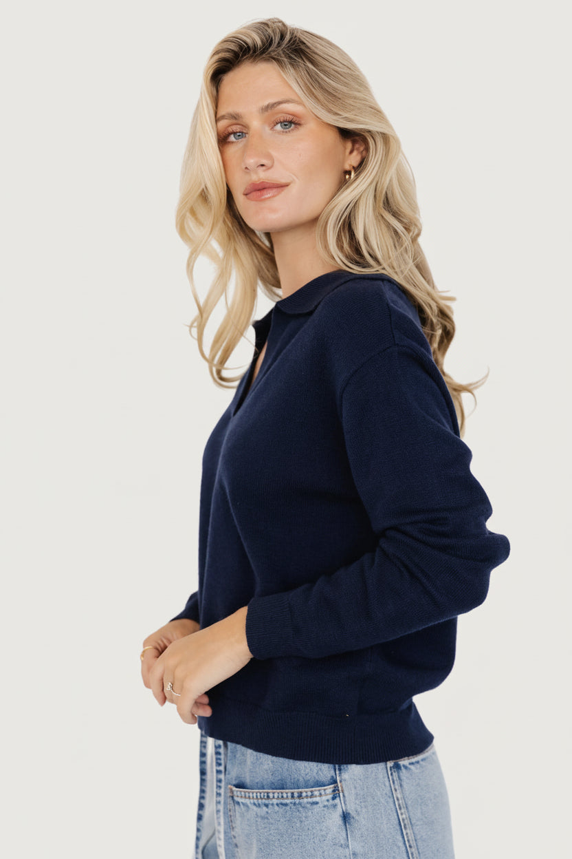 Back and shoulder view of navy Bodhi sweater emphasizing dropped shoulder seam and relaxed back drape for a casual fit.