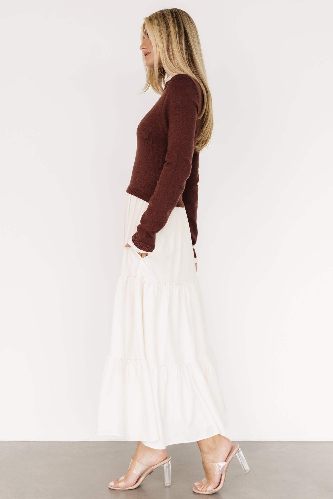 Full-length image of the Sophie Sweater Dress in mahogany and ivory, highlighting the maxi length, three tiers, and elegant drape.