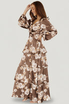 Side view highlighting the short flowy sleeve, contoured under-bust seam and the gentle drape of the fully lined satin skirt.