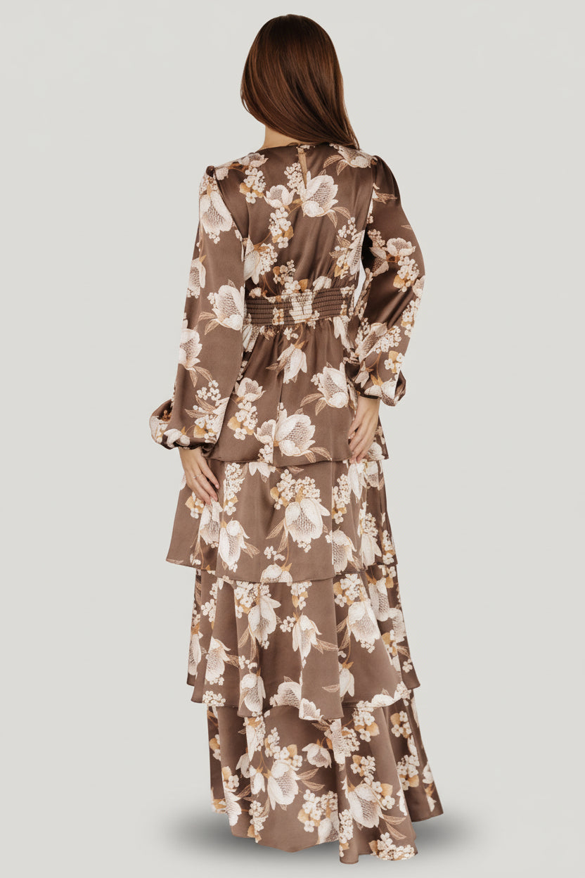 Detail of cascading tiered ruffles on the maxi skirt showing movement, layered construction and the mocha floral print.