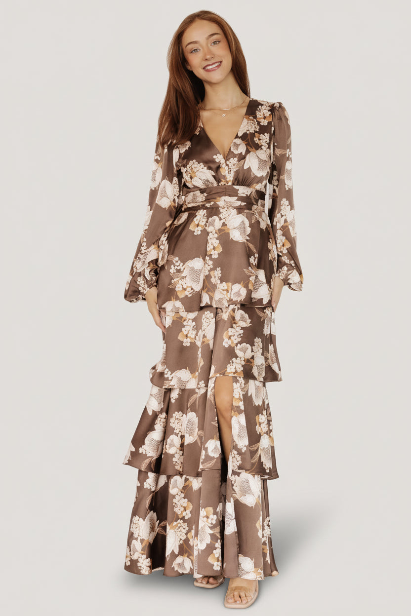 Styled look of the mocha floral satin dress worn with minimal accessories, showing overall fit, tiered skirt and elegant movement.