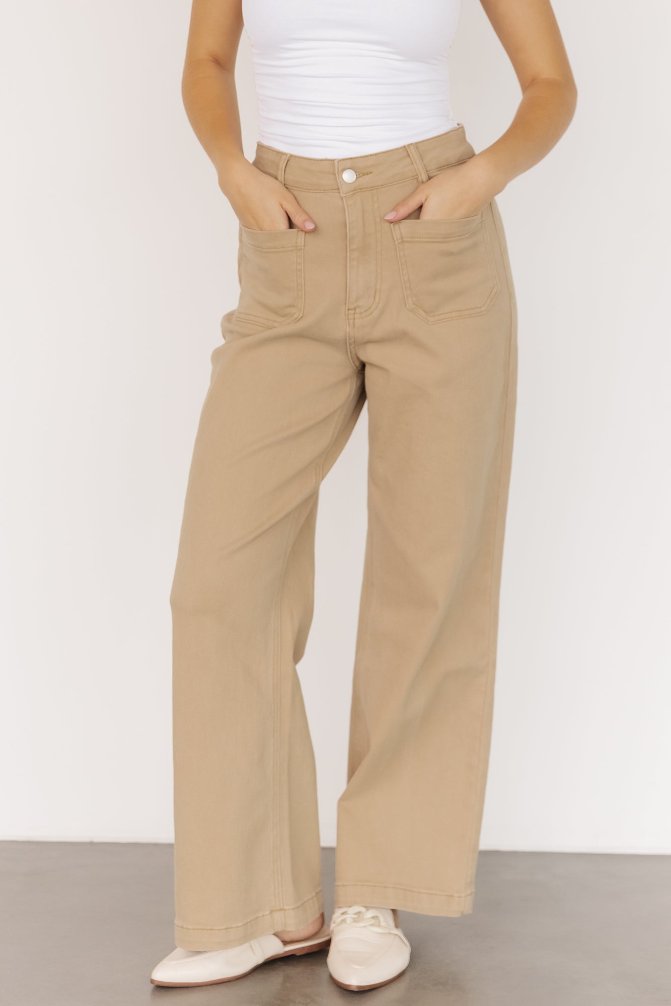Front view of Emery Denim Pants in Natural on model showing high-rise waist, wide-leg silhouette, front pockets, and natural color fabric.