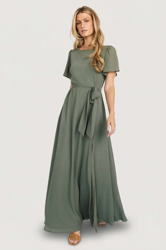 Front model view of Naomi short sleeve chiffon maxi dress in dark sage, showing rounded neckline, removable waist tie, and full maxi sweep.