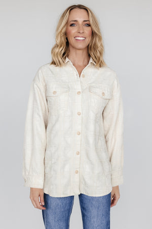 Model wearing Joanna Plaid Shacket in cream and natural, front view showing relaxed fit, collar, and buttoned chest pockets.