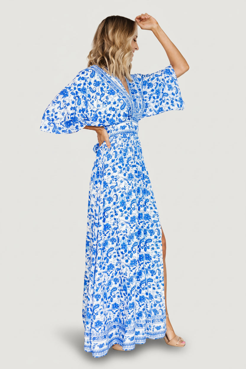 Detail of kimono sleeve and fabric drape showing lightweight 100% rayon texture and blue-white print.