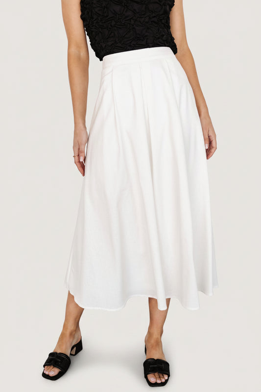 Flat-lay or styled shot of the off-white pleated midi skirt showing overall silhouette, pleat structure, and fabric color.