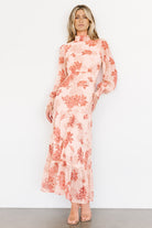 Close-up of Luciana dress neckline and back keyhole, illustrating the smocked high neckline and double-button fastening at the nape.