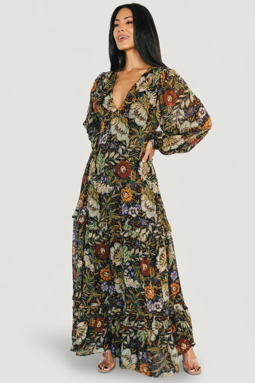 Styled shot of Bowman Deep V Maxi Dress in black multi floral paired with accessories, emphasizing its versatile occasion-ready look.