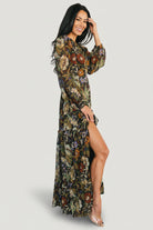 Model walking in Bowman Deep V Maxi Dress, displaying movement of the ruffle-tiered skirt and the dress’s ankle-length hem.