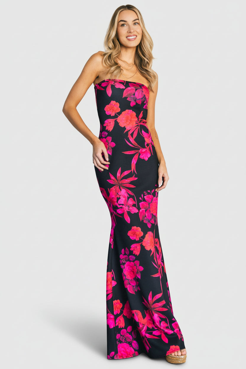 Front view of the Alicante strapless maxi dress in black with pink multi-floral print, fitted lined bodice and trumpet skirt.