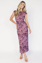 Model wearing a dusty plum floral mesh midi dress with a round neckline, short sleeves, and a fitted bodycon silhouette.