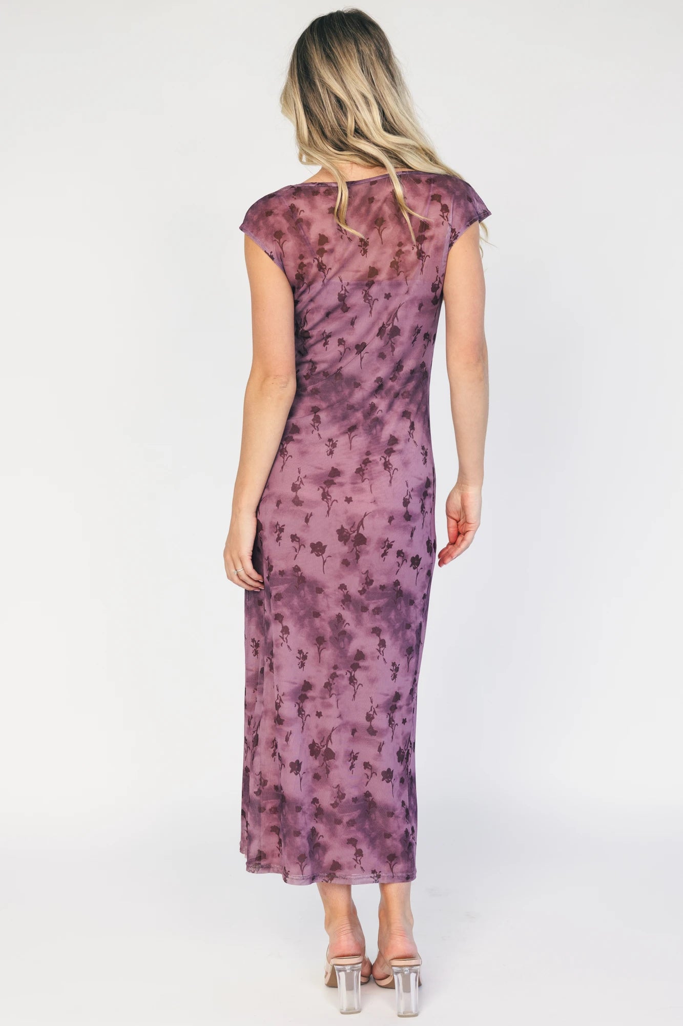 Model wearing a dusty plum floral mesh midi dress with a round neckline, short sleeves, and a fitted bodycon silhouette.