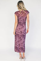 Model wearing a dusty plum floral mesh midi dress with a round neckline, short sleeves, and a fitted bodycon silhouette.
