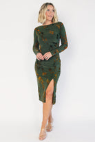 Green velvet floral midi dress with a boat neckline, long sleeves, side ruching, and a side slit.