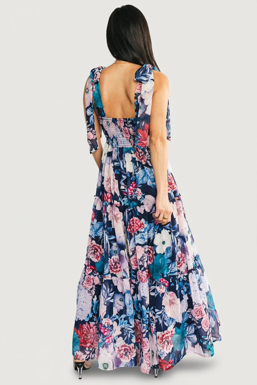 Detail image of Anita Maxi Dress showing ruffle edge, fabric drape, and close-up of floral print on dark blue chiffon overlay.