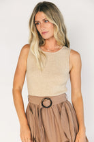 Model wearing the Stacy Midi Dress in Taupe + Mocha featuring a ribbed taupe knit bodice with a bateau neckline and a flowing woven midi skirt.