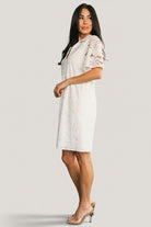 Full-length shot of Calida Lace Dress in off-white on model, styled with minimal accessories for bridal or event inspiration.