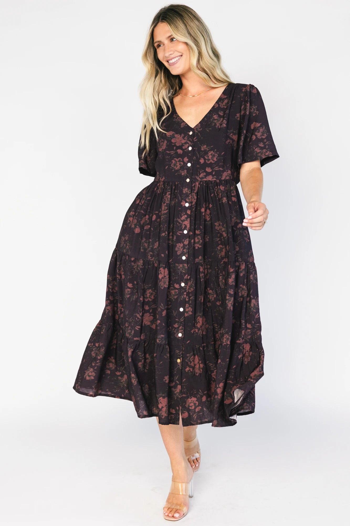 Annelise Midi Dress in Deep Plum with brown undertones, button-front V-neck, puff sleeves, and tiered midi skirt.