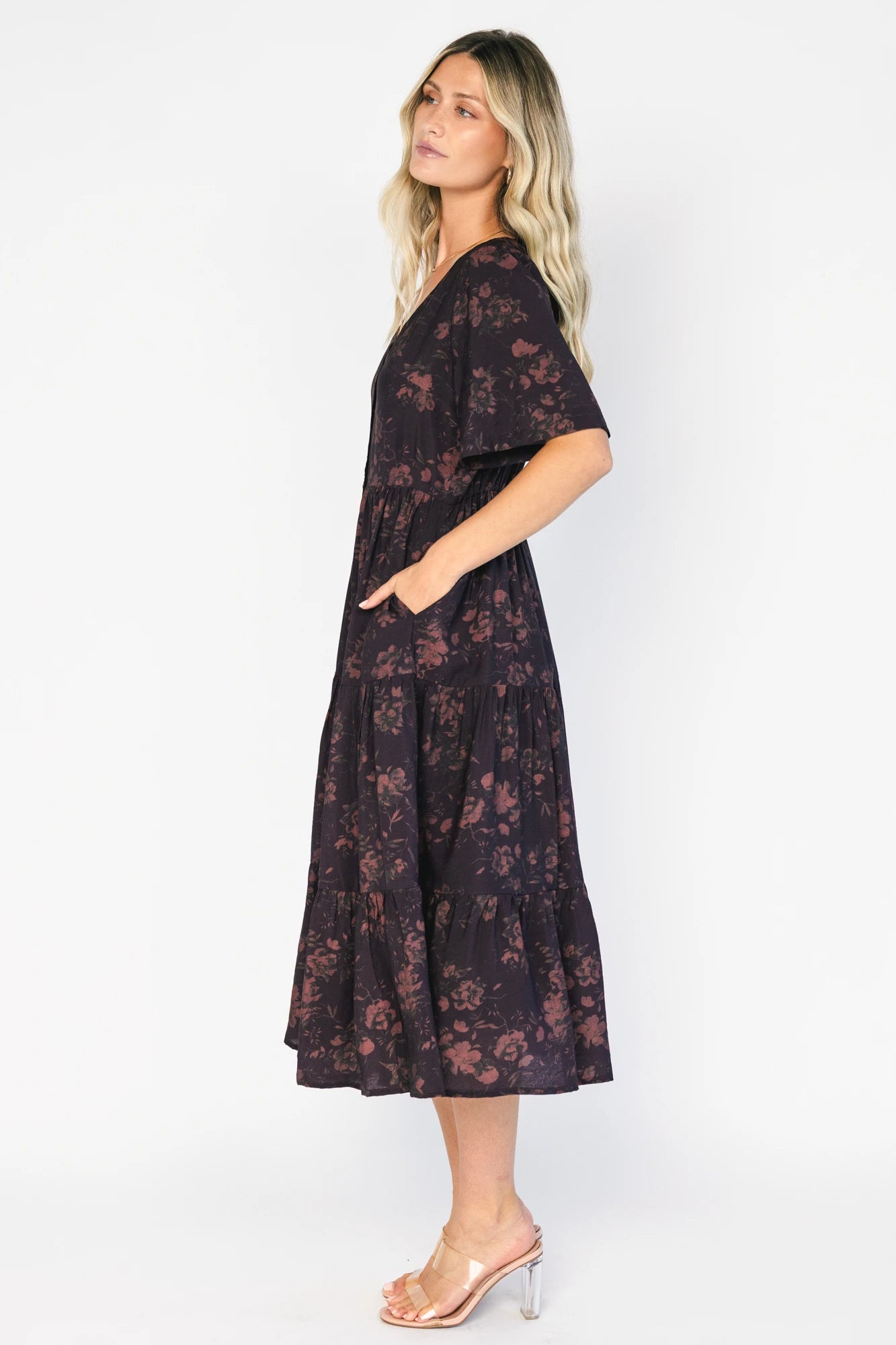 Annelise Midi Dress in Deep Plum with brown undertones, button-front V-neck, puff sleeves, and tiered midi skirt.