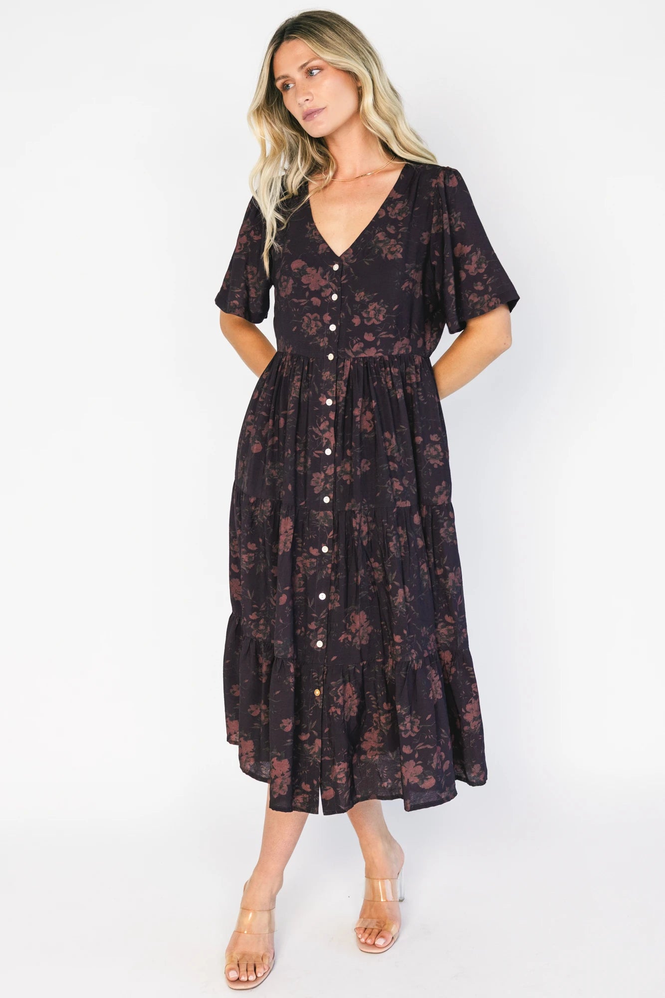 Annelise Midi Dress in Deep Plum with brown undertones, button-front V-neck, puff sleeves, and tiered midi skirt.