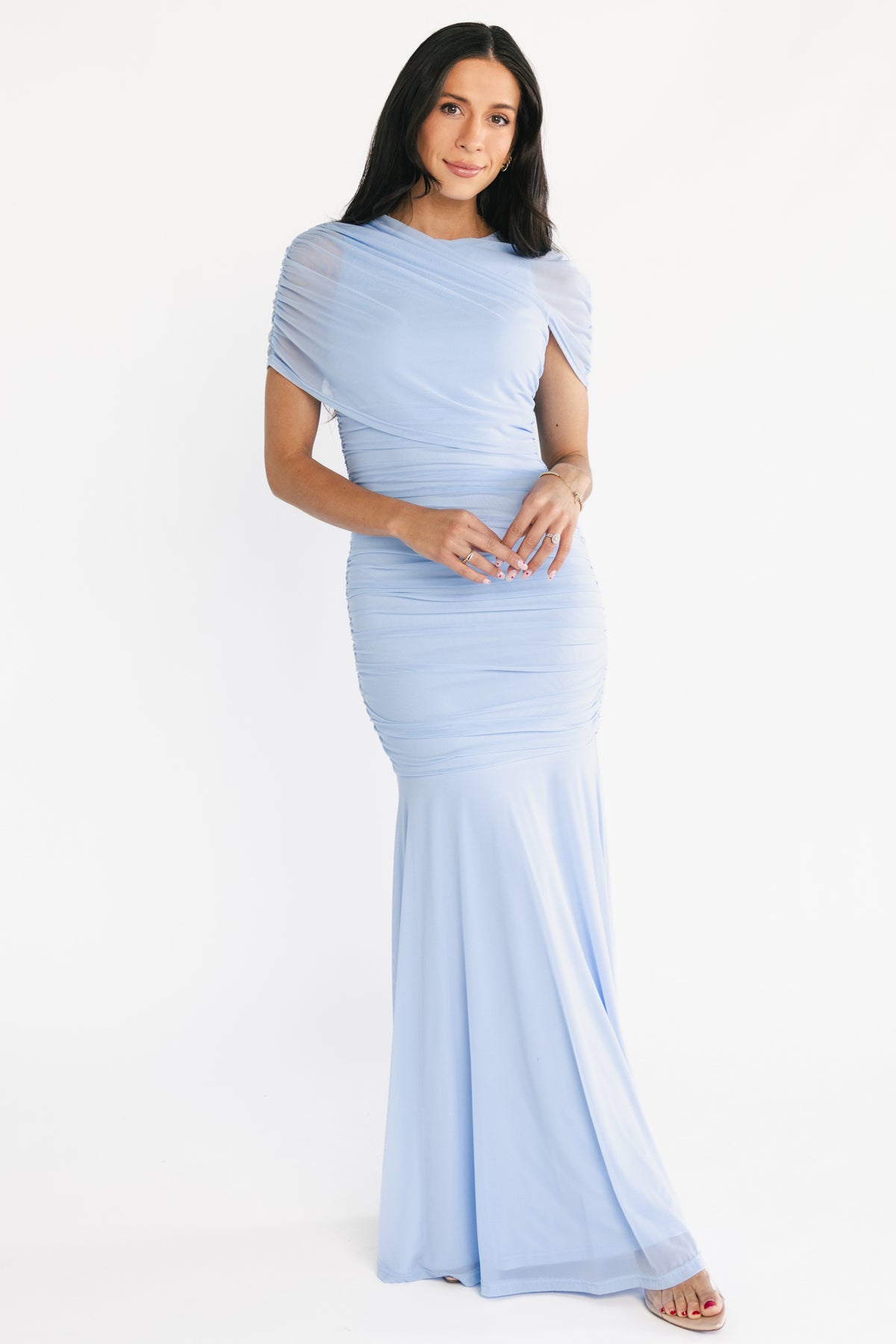 Front view of light blue Serenade Maxi Dress in stretch mesh, showing high asymmetrical neckline, draped shoulder overlay and ruched bodice.