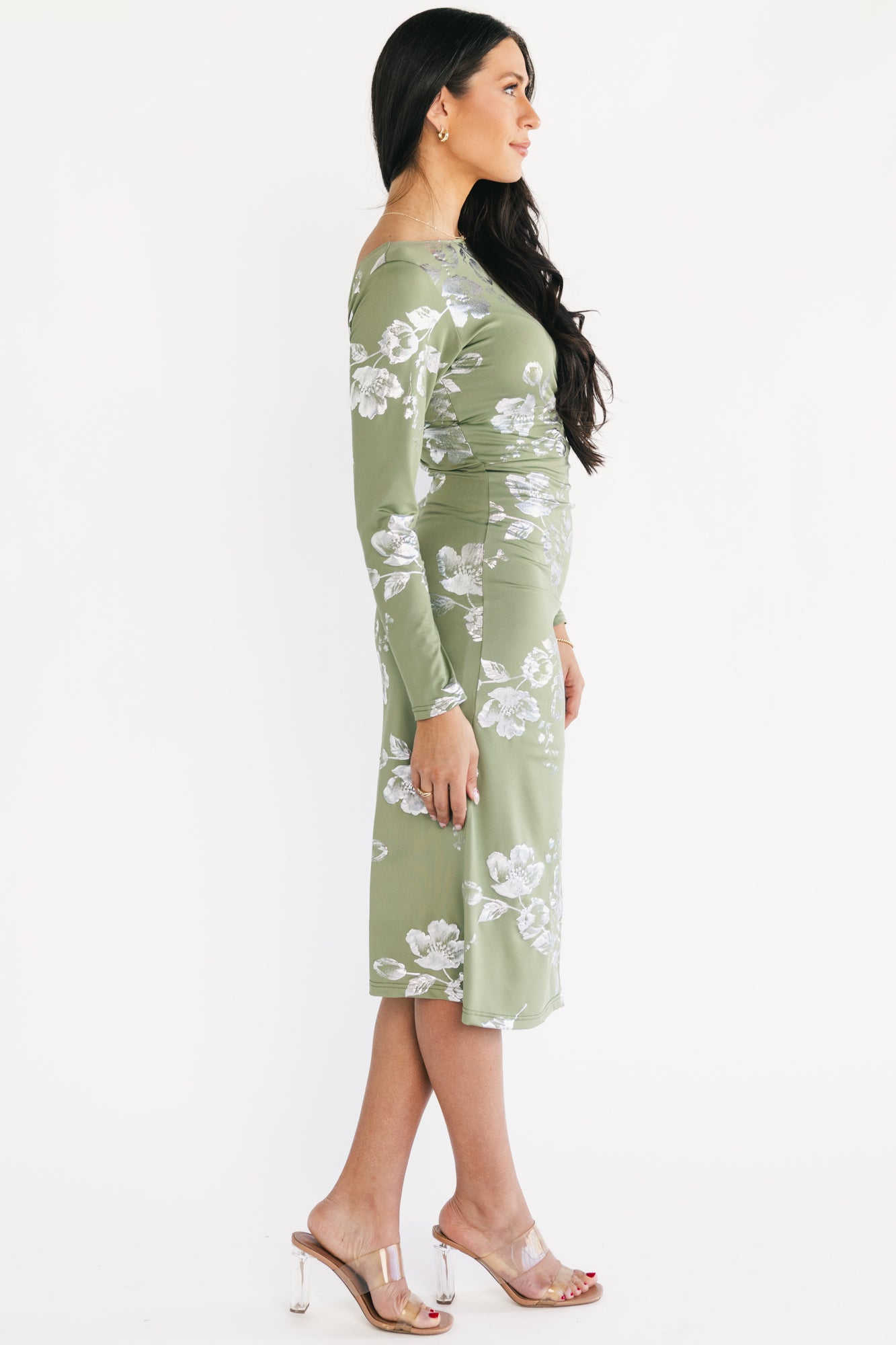 Back view of Valeria Midi Dress in sage with scoop back and hidden back zipper visible on the model.