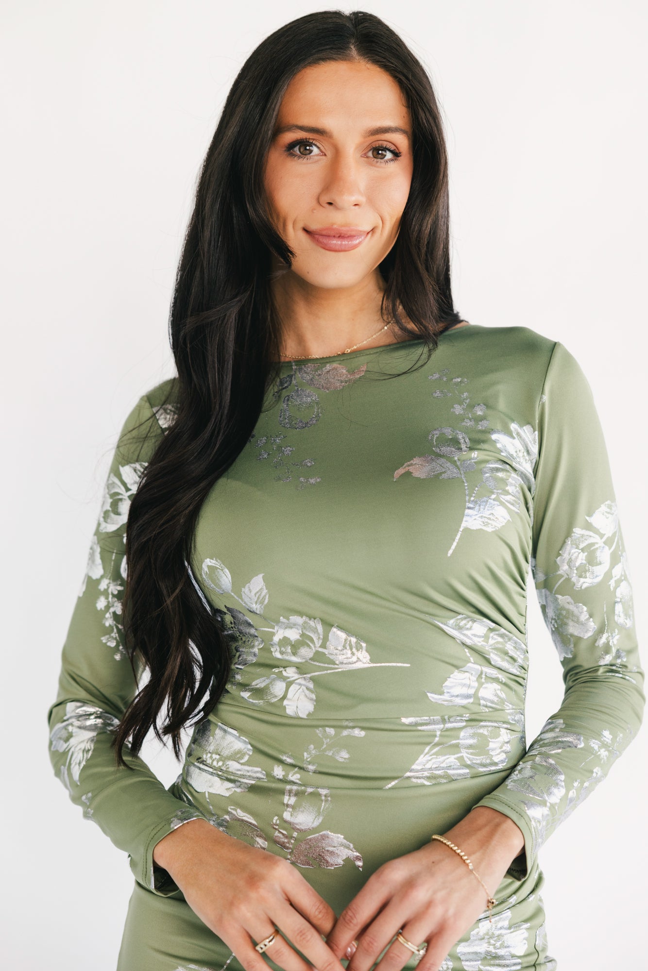 Three-quarter side view of Valeria Midi Dress in sage and silver, highlighting the gathered left-side detail and left leg slit.