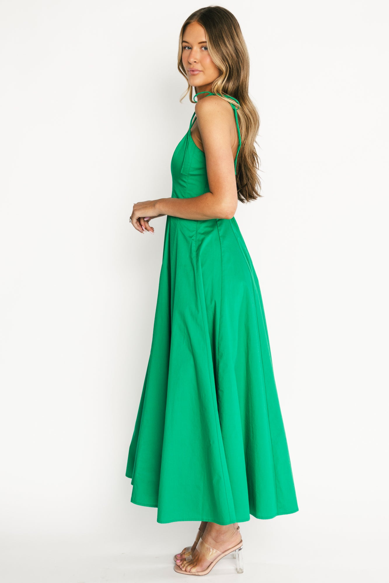 Back view of the Kitty Maxi Dress revealing the smocked back panel that provides flexible fit and subtle texture in the green fabric.