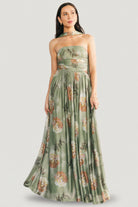 Three-quarter view of model wearing the dark sage floral Elias strapless maxi, highlighting side seam, mesh texture, and floral print scale.