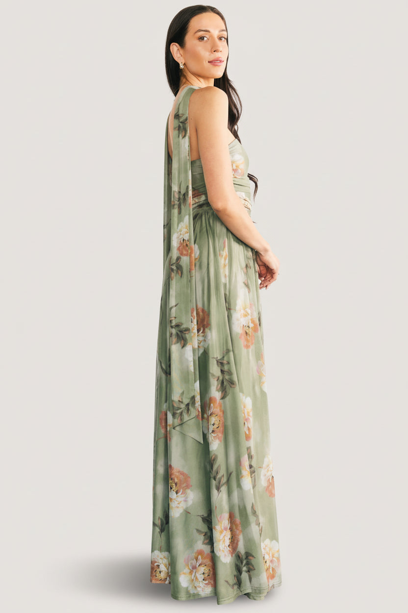 Model walking in the Dark Sage Floral maxi dress, showing natural drape, mesh stretch and wedding-guest styling with movement.