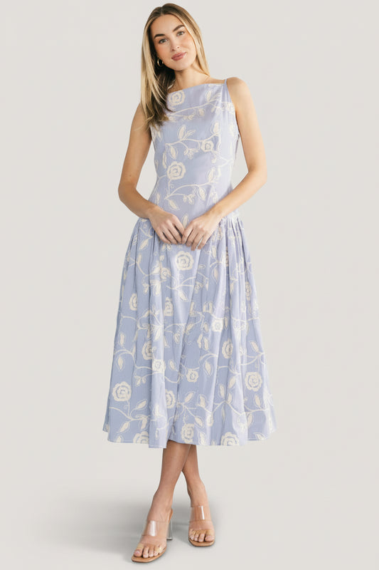 Front view of Shea Embroidered Dress in blue and off-white stripes with cream floral embroidery, square neckline, adjustable tank straps, and midi hem.