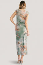 Back view of Daniela Mesh Midi Dress in dusty sage floral showing short sleeves and bodycon silhouette on model.