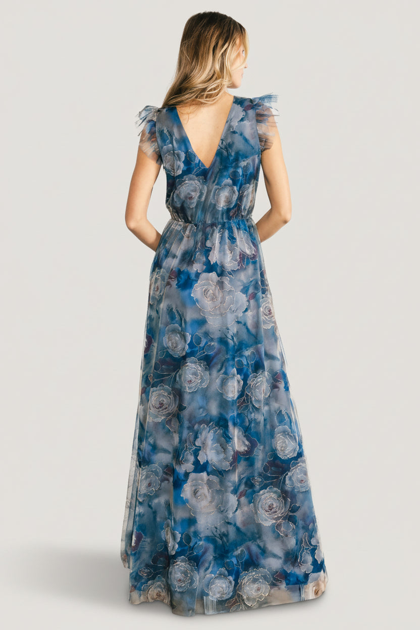 Detail view of fabric and print on the blue floral Adelyn Maxi Dress with emphasis on tulle overlay texture and floral patterning.