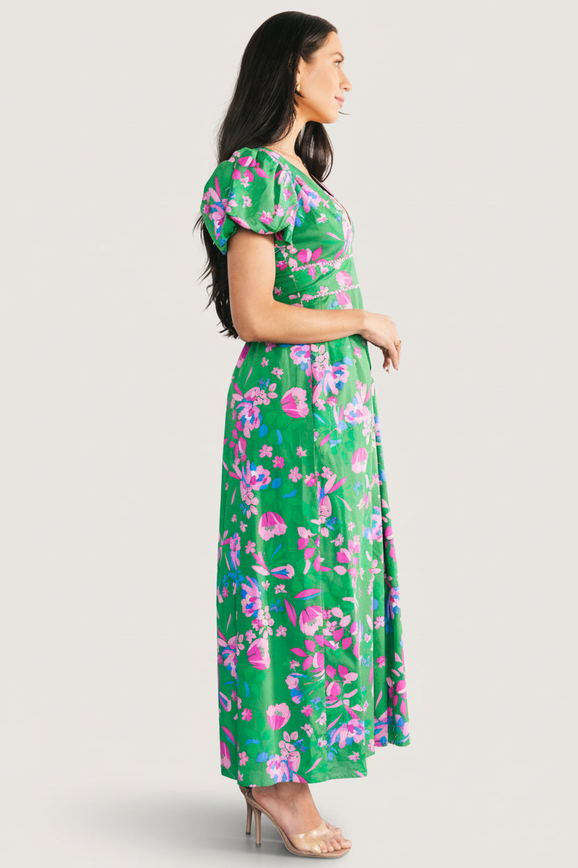 Back view showing the smocked panel and keyhole back with neck tie on the green multi floral Anya Maxi Dress.