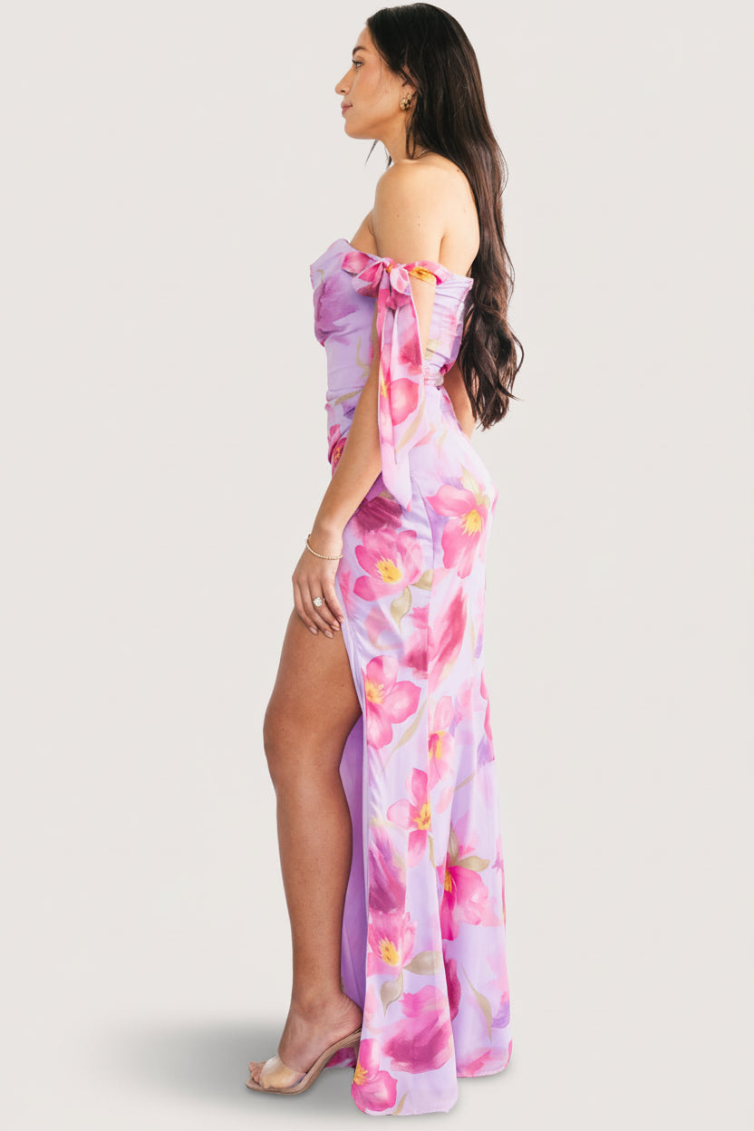 Detail shot of lavender fabric and multi-hued floral pattern on lightweight polyester chiffon with fully lined finish.