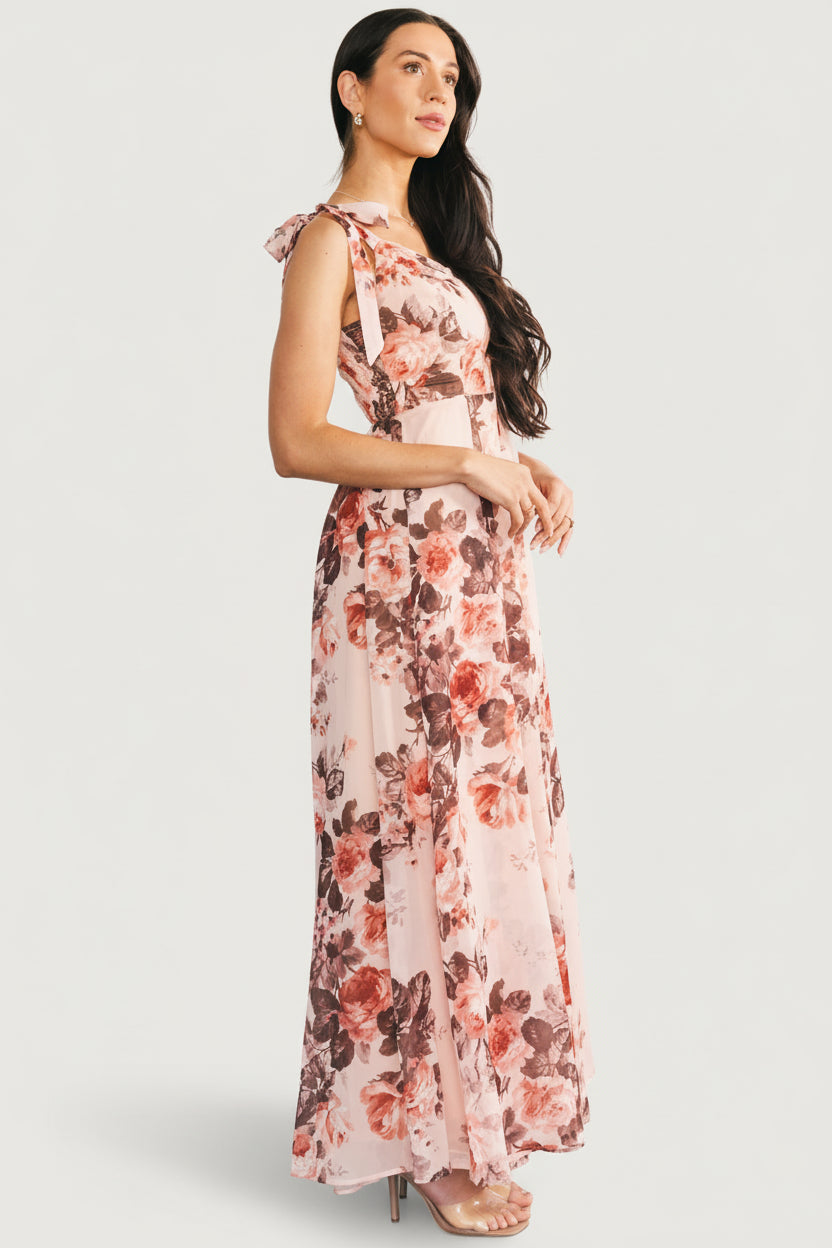 Flat-lay of Macey Maxi Dress displaying full-length silhouette, adjustable straps, smocked back detail, and pink floral pattern.