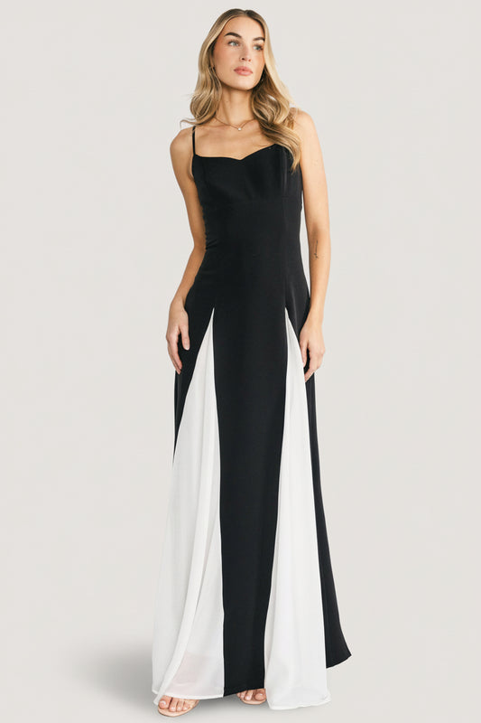 Front view of Adela maxi dress in black knit with white chiffon godet panels, sweetheart neckline and adjustable straps.