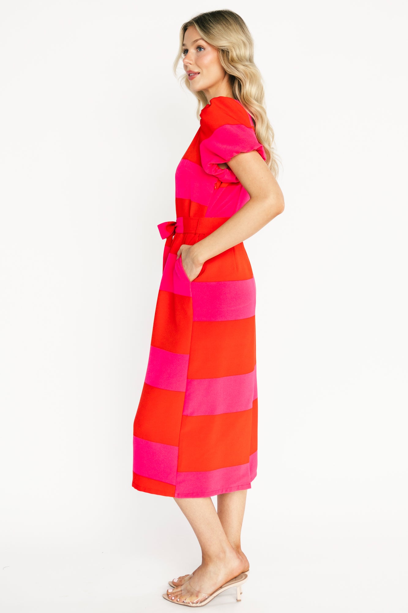 Model wearing Andi Striped Midi Dress walking pose showing chiffon skirt movement, midi length fall, and fully lined interior for coverage and smooth silhouette.