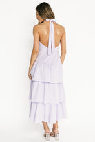 Detail view of the fully lined interior and clean hem finish on the Savannah Tiered Maxi Dress in light purple.