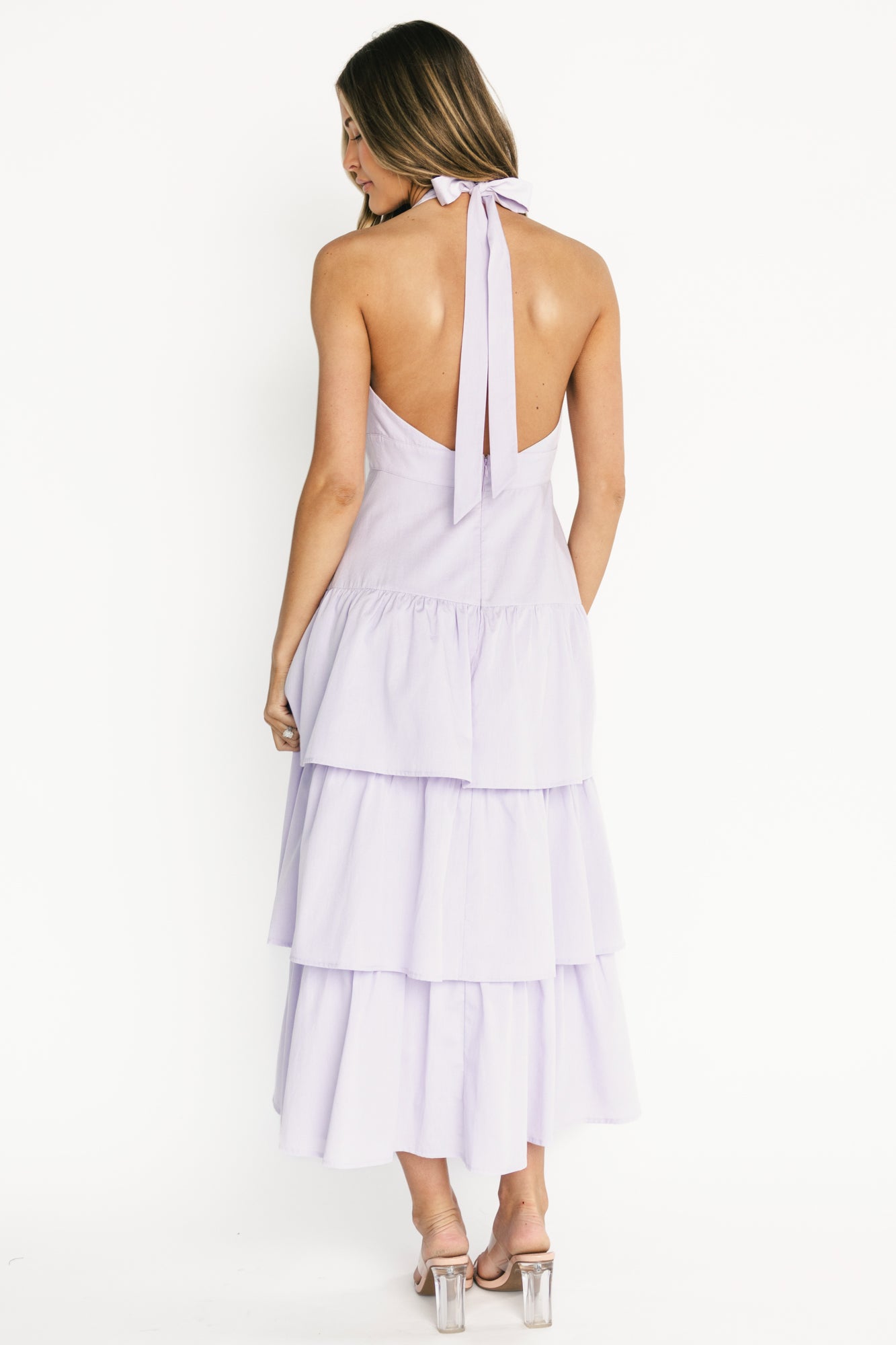 Detail view of the fully lined interior and clean hem finish on the Savannah Tiered Maxi Dress in light purple.