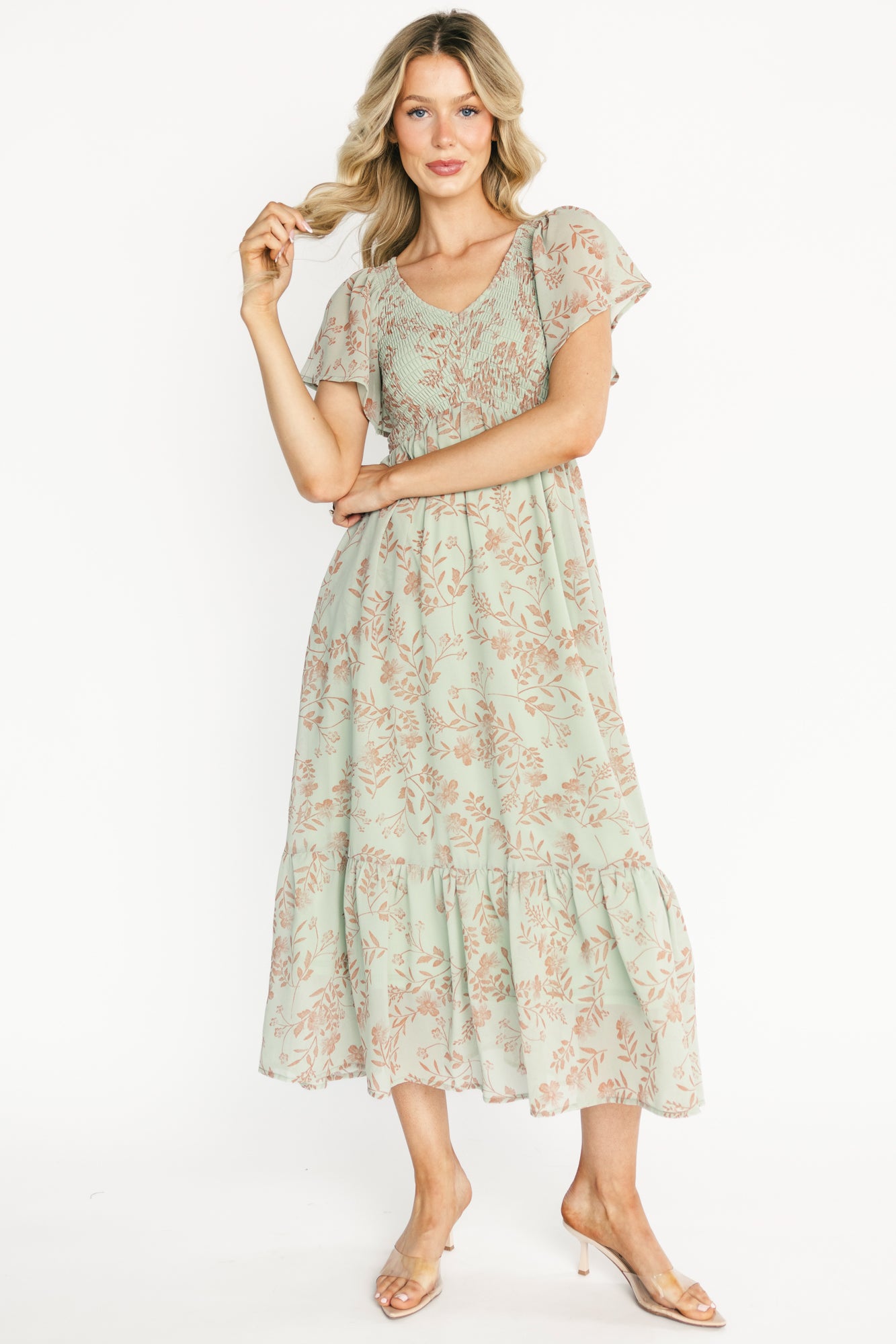 Front view of Monica Smocked Maxi Dress in dusty sage with terracotta floral print, V-neck, smocked bodice and flutter sleeves.